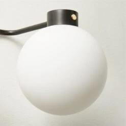 Marra 3-Bulb Black Globe Vanity Light -Cb2 MarraBkPldBrs3BlbVntyScncAVSHS23